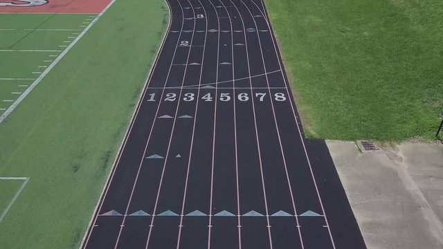 4k drone flying over running track