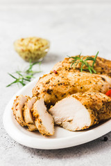 Baked mustard honey chicken breasts with cherry tomatoes. Selective focus, space for text.