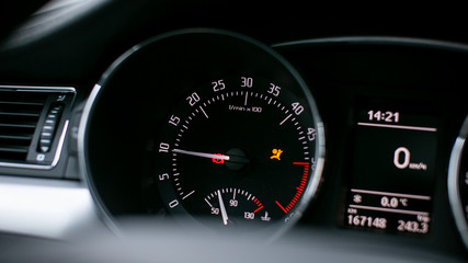 Modern car dashboard. Tachometer, fuel level and icons on the panel screen.