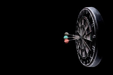 Darts, three darts in a bull's eye.
