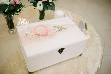 Cardboard gift box with a bow is on the table