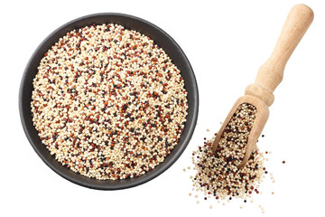 quinoa in a black bowl isolated on white background. quinoa seed. top view