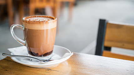 cup of coffee on wooden table