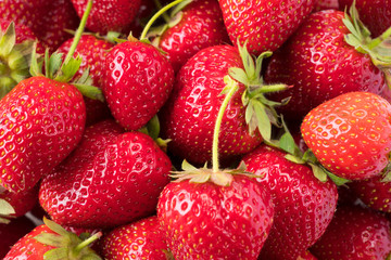 Background of fresh strawberries. Ripe strawberries. Ripe berries close-up. Various fresh summer berries. Background of red berries.