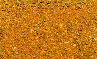 Photo of closeup texture of orange spice for meat and chicken and other food, background