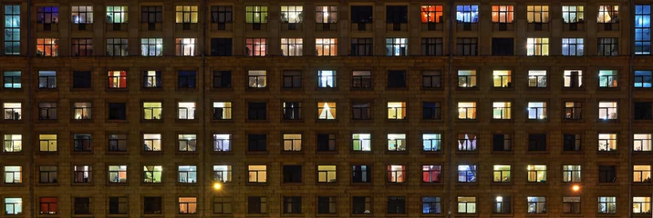 Panorama of the night Windows of the city apartment building © parsadanov