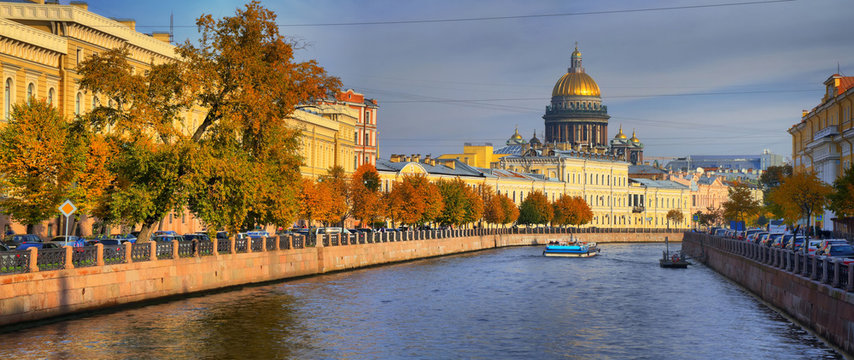 Panorama of the Moika river embankment and St. Isaac's Cathedral in St. Petersburg