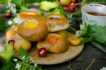 Baking with fruit filling over wood rustic background with cherry and apricot, Food still Life