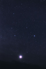 Fototapeta na wymiar Starry sky with clouds at night