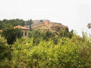 Fototapeta na wymiar Alanya Castle fortress wall and trees. Alanya, Antalya, Turkey