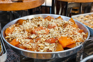 Traditional Turkish dessert of sweet pumpkin with tahini sauce
