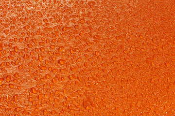 Orange texture with water droplets