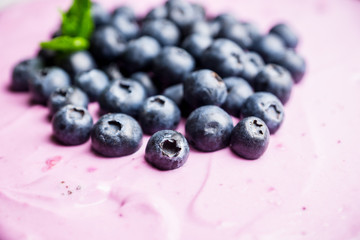 Fresh blueberry cheesecake on the rustic background. Selective focus. Shallow depth of field.