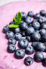 Fresh blueberry cheesecake on the rustic background. Selective focus. Shallow depth of field.