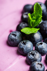 Fresh blueberry cheesecake on the rustic background. Selective focus. Shallow depth of field.