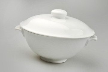 Large ceramic tureen on a gray background