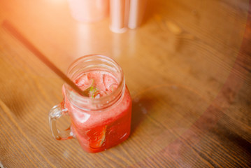  smoothie shake against colored wall. Drinking healthy smoothie concept.