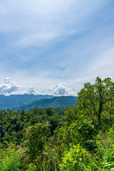 Blue sky high peak mountains fog hills mist scenery national park views at Phu Tub Berk, Khao Koh, Phetchabun Province, Thailand