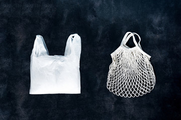 polyethylene plastic package and fabric bag on black  background