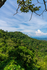 Blue sky high peak mountains fog hills mist scenery national park views at Phu Tub Berk, Khao Koh, Phetchabun Province, Thailand