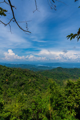 Blue sky high peak mountains fog hills mist scenery national park views at Phu Tub Berk, Khao Koh, Phetchabun Province, Thailand