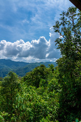 Blue sky high peak mountains fog hills mist scenery national park views at Phu Tub Berk, Khao Koh, Phetchabun Province, Thailand