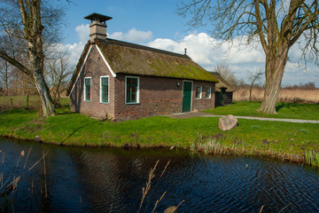 Fototapeta na wymiar Tiny house. National Park Weerribben Overijssel Netherlands. Moor and peatfields