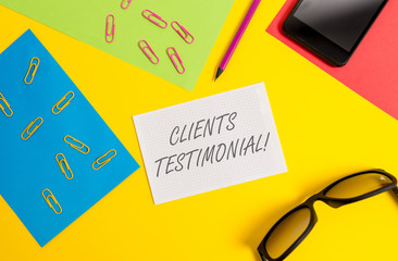 Text sign showing Clients Testimonial. Business photo text Formal Statement Testifying Candid Endorsement by Others Paper sheets pencil clips smartphone eyeglasses notebook color background