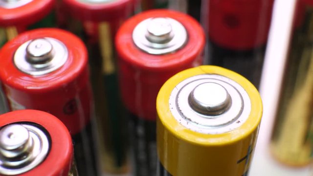 Different types of used batteries in heap