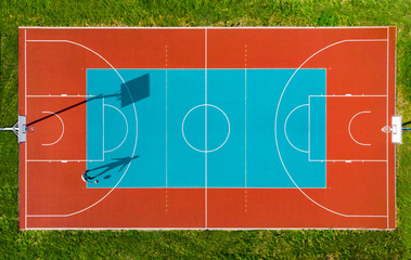 Man Play Basketball on Outdoor Court, Creative Aerial Drone Image