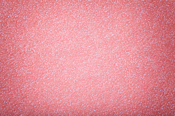 Texture of old pink paper background, closeup. Structure of dense rose cardboard.