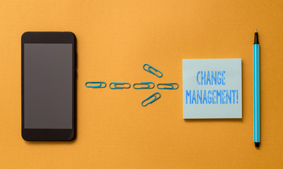 Writing note showing Change Management. Business concept for Replacement of leadership in an organization New Policies Colored sticky note clips smartphone pen trendy cool pastel background