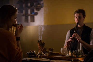 Man playing japanese bamboo flute - shakuhachi