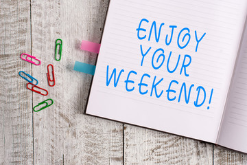 Text sign showing Enjoy Your Weekend. Business photo text wishing someone that something nice will happen at holiday Thick pages notebook stationary placed above classic look wooden backdrop