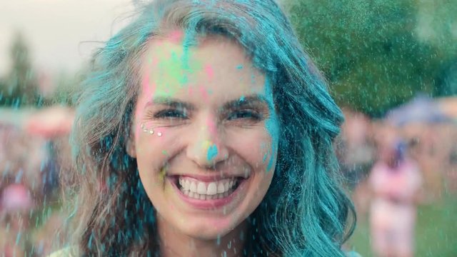 Happy woman in holi colors