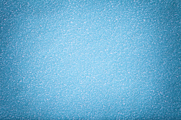 Texture of light blue paper background, closeup. Structure of dense cardboard.