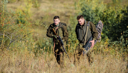 Poacher partner in crime. Activity for real men concept. Hunters gamekeepers looking for animal or...
