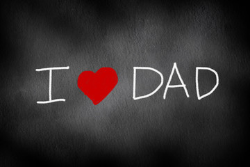 black chalkboard background texture with text handwriting i love dad for happy father's day concept