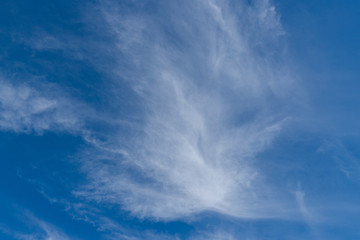 Thin white clouds on blue sky.