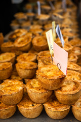 Delicious Golden Baked Pies For Sale at a Farmers Market © ystewarthenderson