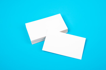 Business card, white clean on blue background. Mock up for design. is isolated
