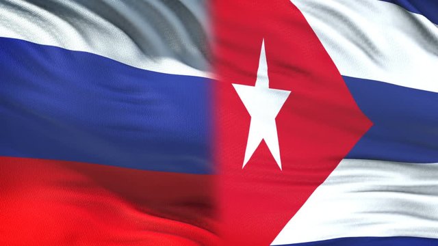 Russia and Cuba officials exchanging confidential envelope, flags background