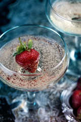 Two glasses of champagne with strawberries