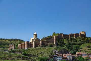 Fototapeta na wymiar Georgia Travel. ancient castles and fortresses Georgia. ancient walls and architecture of georgia. view of tbilisi