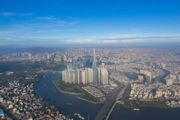 Top View of Building in a City - Aerial view Skyscrapers flying by drone of Ho Chi Mi City with development buildings, transportation, energy power infrastructure. include Landmark 81 building 