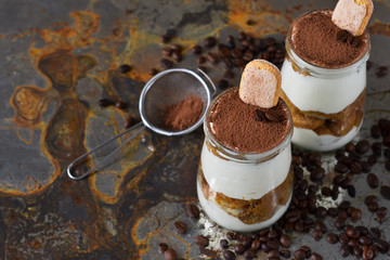 Italian dessert tiramisu on an old grunge background