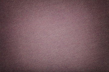 Light brown matt suede fabric closeup. Velvet texture of felt.