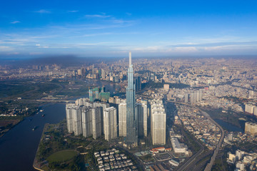Top View of Building in a City - Aerial view Skyscrapers flying by drone of Ho Chi Mi City with development buildings, transportation, energy power infrastructure. include Landmark 81 building 