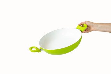A woman's hand holding a frying pan. Isolated objects on white background