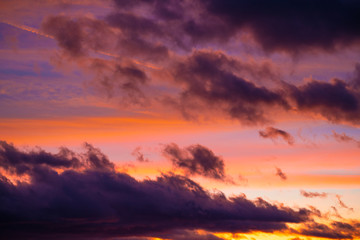 Naklejka na ściany i meble Dramatic sunset sky at colorful dusk
